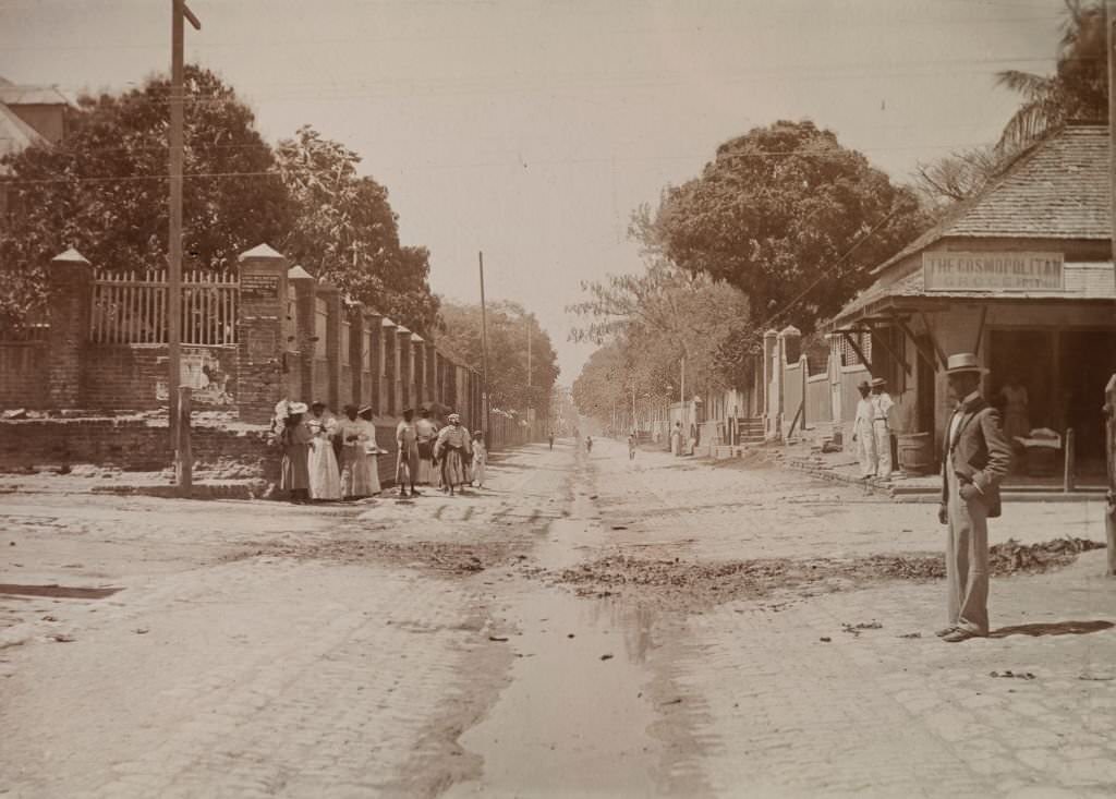 Street scene showing a sign that reads: 'Cars will not stop between North St. and Drummond St. on the up trip, 1894