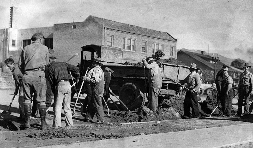 Civil Works Administration men from Pasadena help clear Honolulu Avenue in Montrose following flooding during New Year's Eve storm, 1934