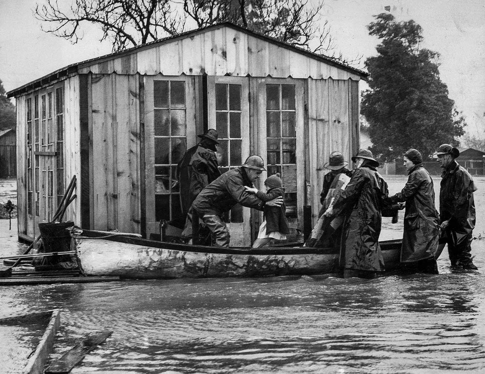 The family of J.E. Webb in Venice is rescued by boat, and two children with mumps were sent to a hospital, 1938