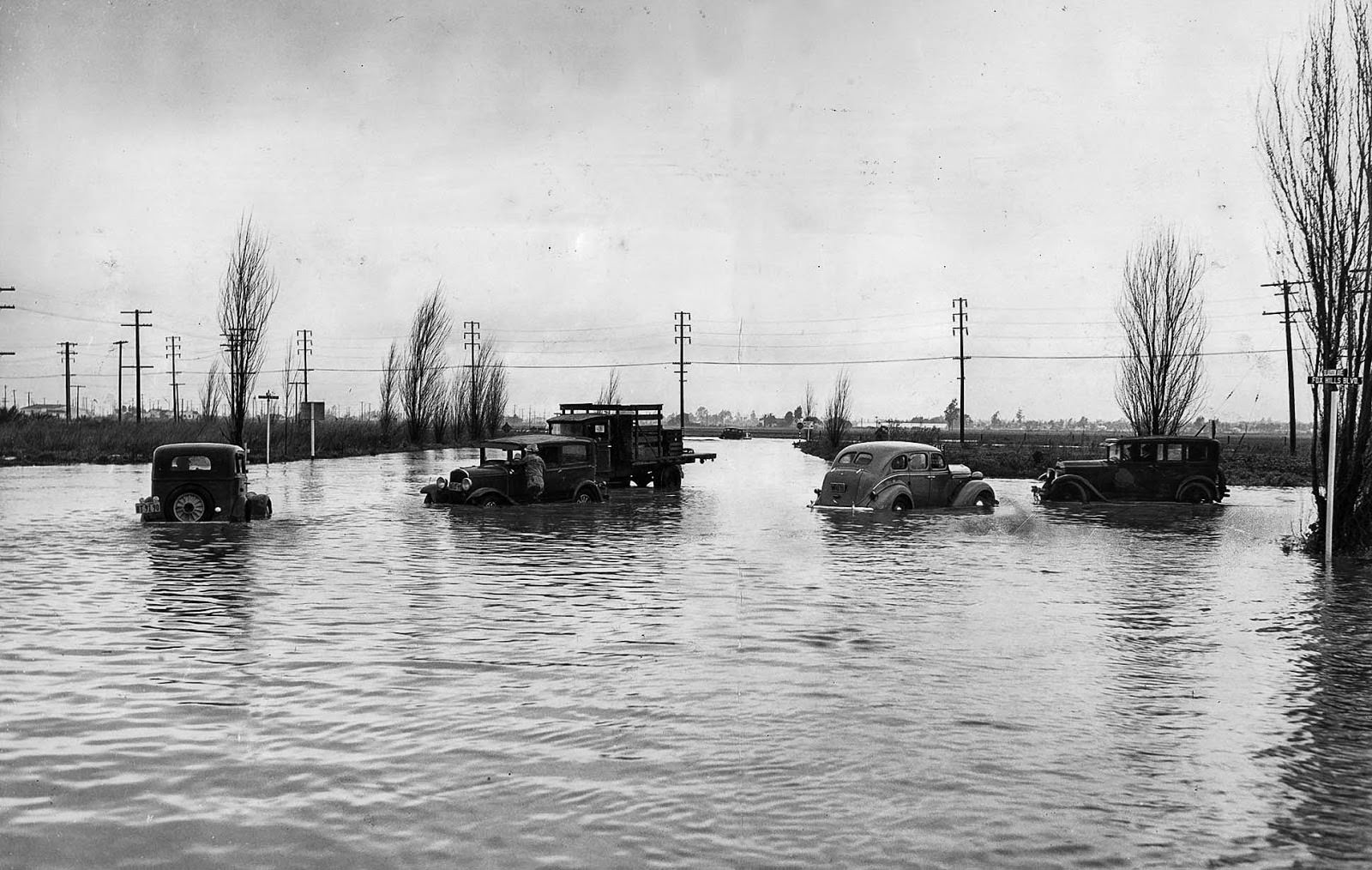 Autos stall in flooded Fox Hills Boulevard and Slauson Avenue after the first storm brought about 4 inches of rain, 1938
