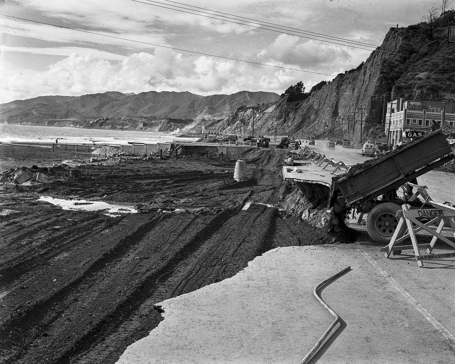 A portion of Roosevelt Highway (now Pacific Coast Highway) at Santa Monica Canyon is repaired after heavy rains, 1938