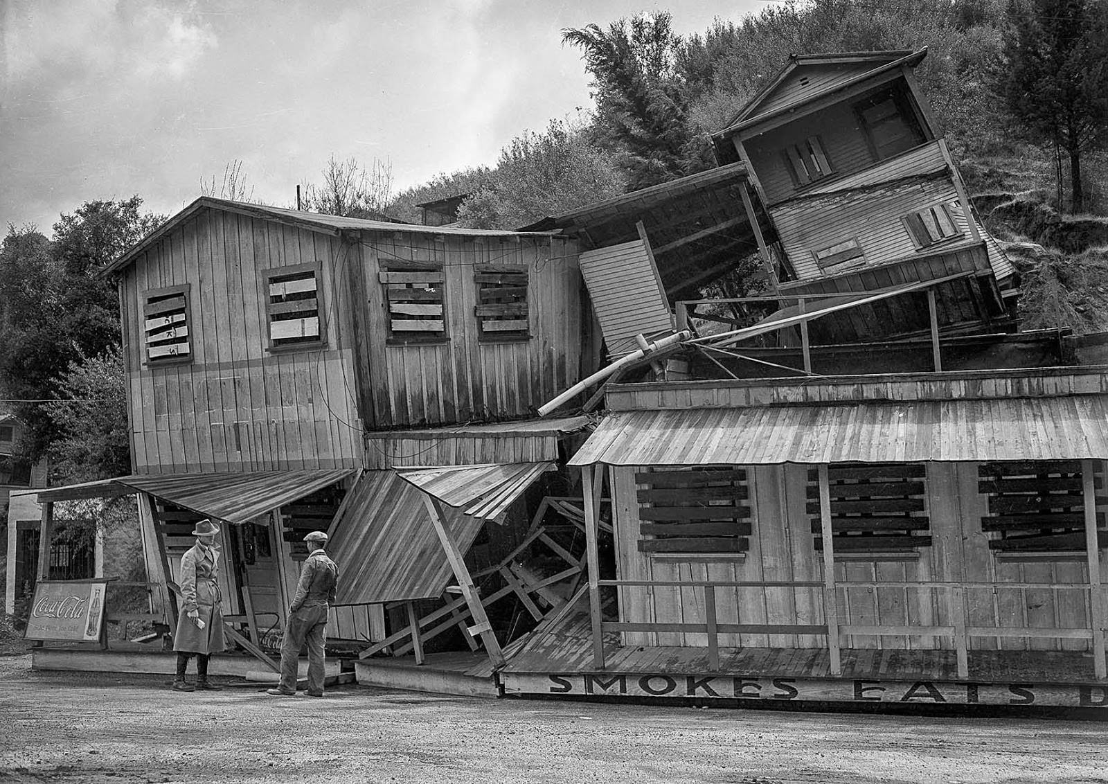 A three-story structure once occupied by cafe at Cheeney Road and Topanga Canyon Road collapsed and toppled into the highway as prolonged rains softened foundations, 1938