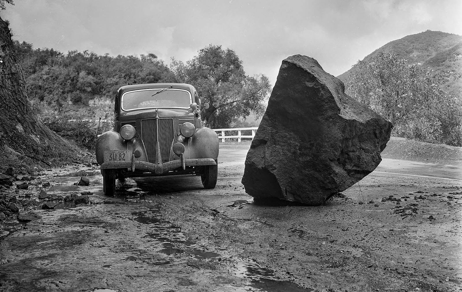 A boulder on a road after a rainstorm on March 1, 1938.
