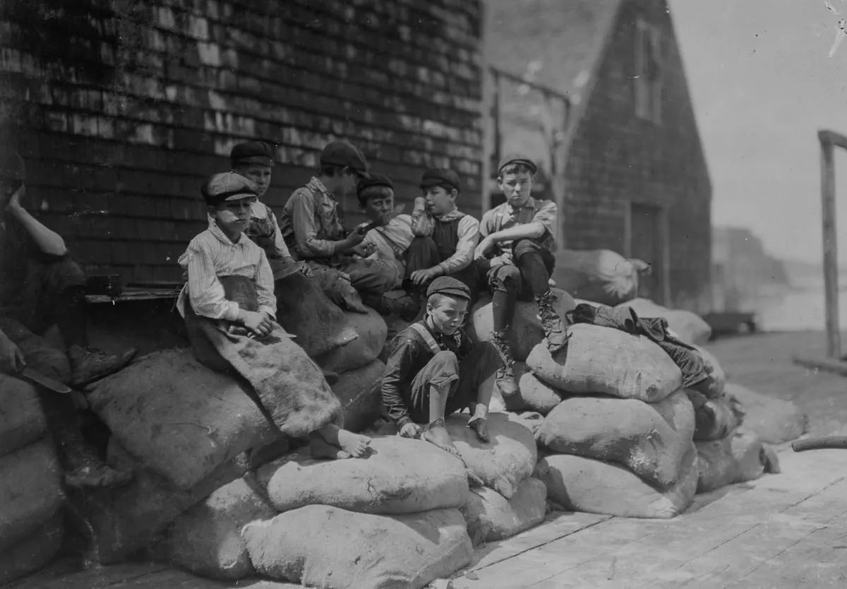 Group of young cutters, Seacoast Canning Co., Factory #2, waiting for more fish.