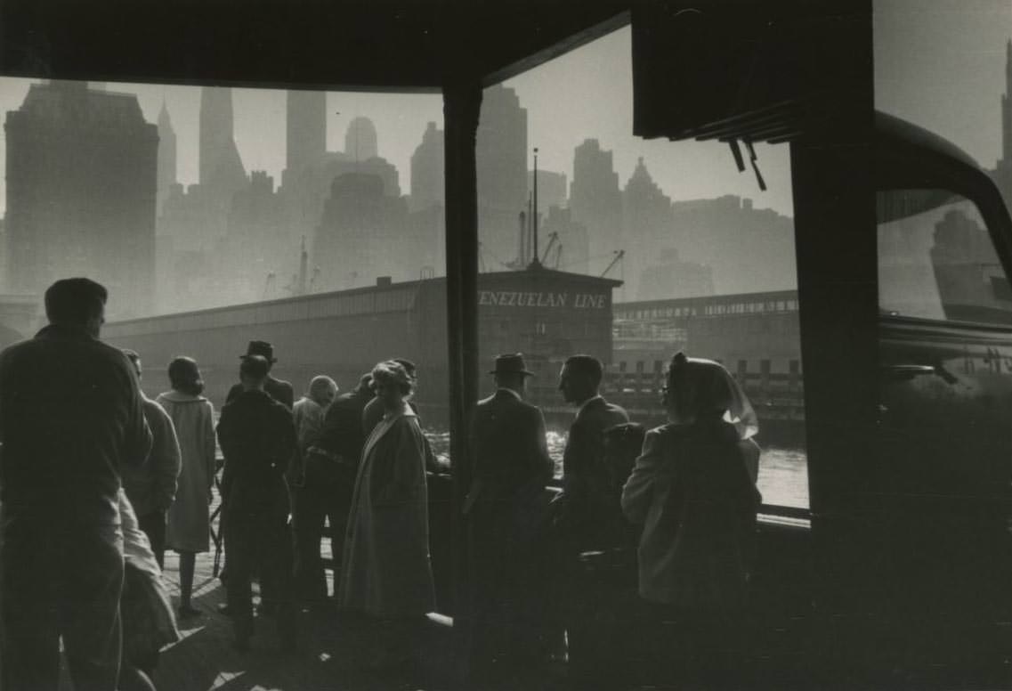 The Liberty Street Ferry approaching dock in Manhattan in the early morning, 1950