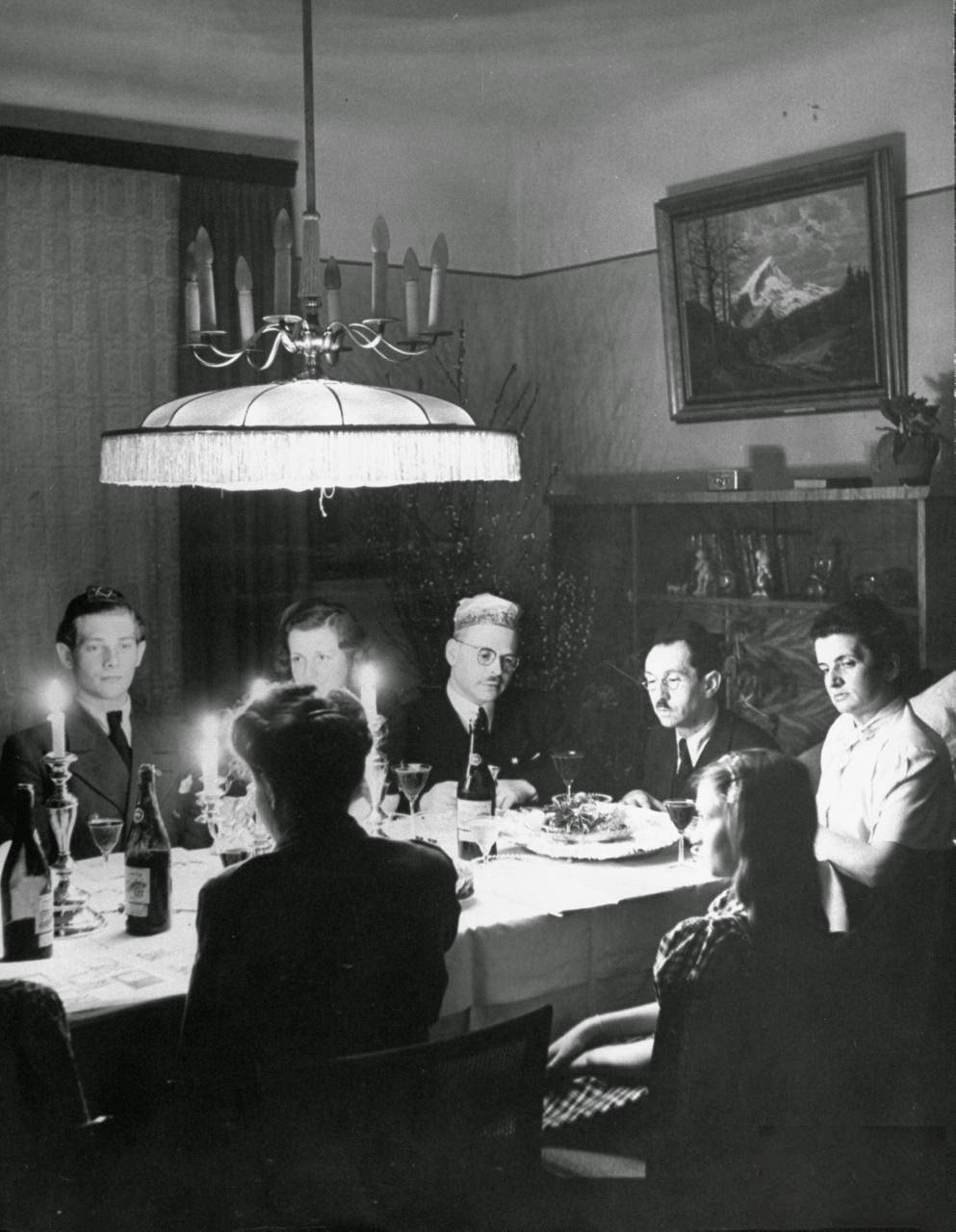 A family and their guests having Passover Eve seder.