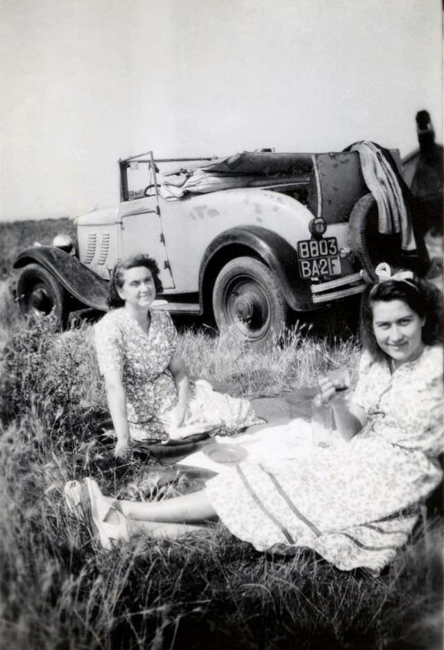 Two ladies, probably mother and daughter, enjoying a picnic in the countryside, 1948