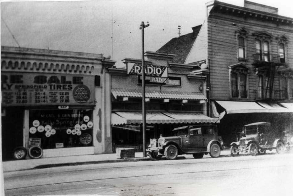 The wooden frame building on the right is the old Renzel house, 1920s