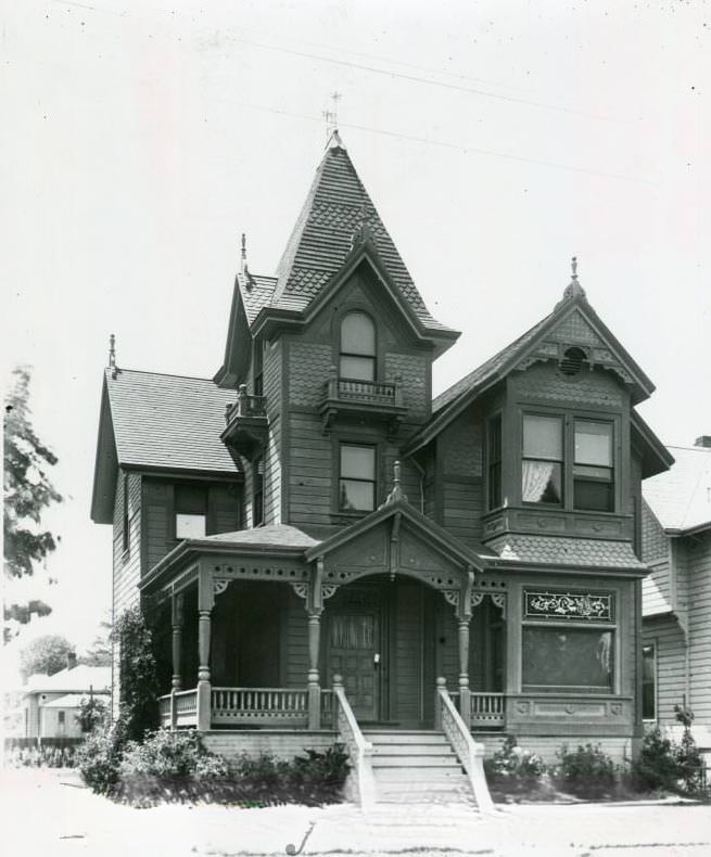 Three-story Carpenter's Gothic Victorian, with stained glass window, 1970s