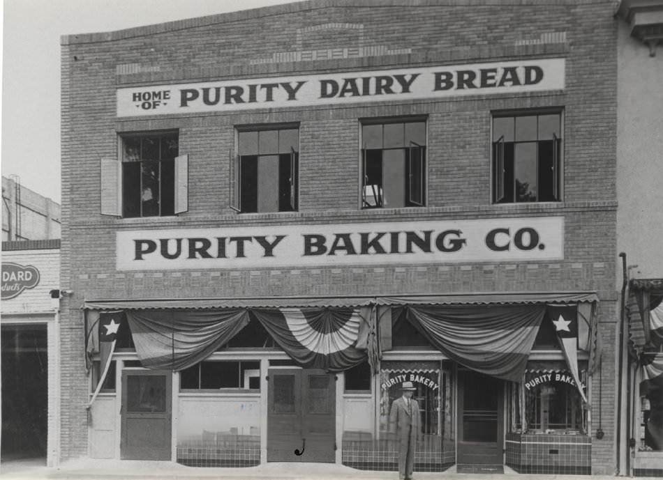 Peter Andreucetti in front of the Purity Baking Company building, 1925