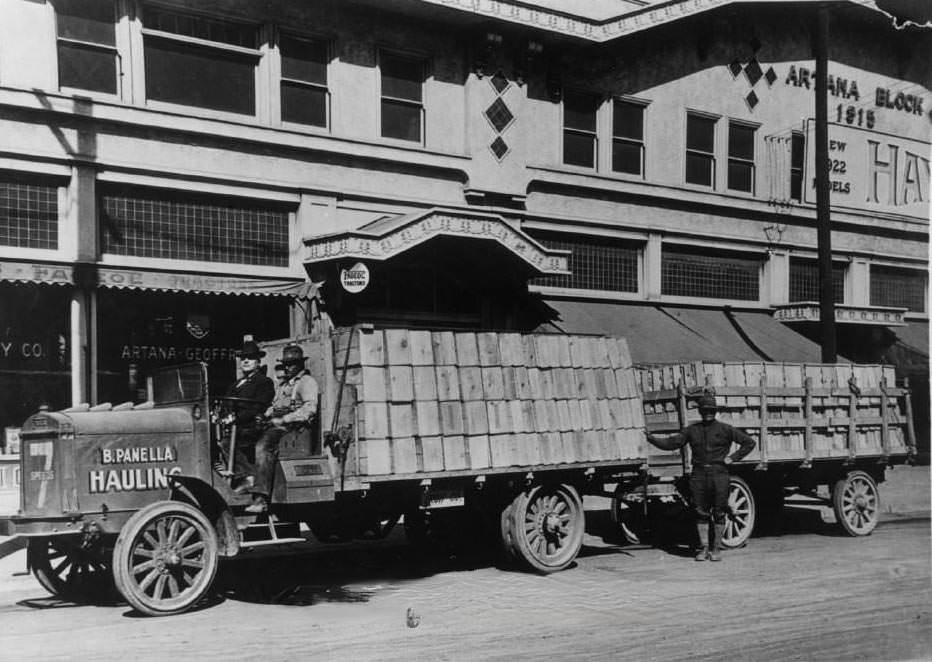 Bernard Panella Hauling Co. truck and trailer loaded with fruit boxes. In the background is the Artana building located at 349 West Santa Clara Street, 1922
