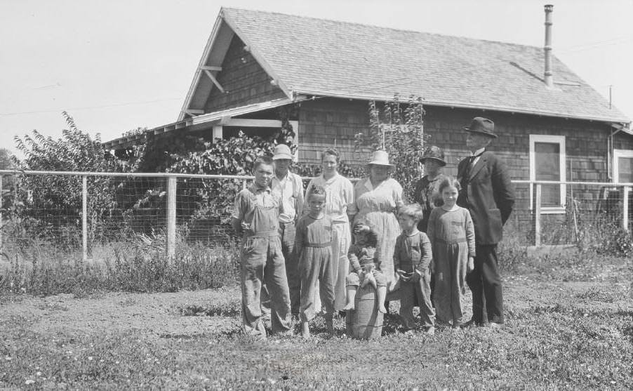 A family standing in front of a building, 1921