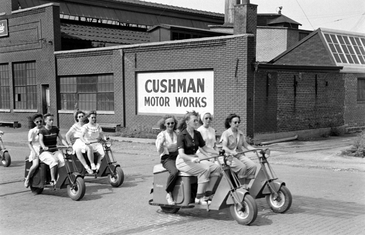 Outside the Cushman Motor Works scooter plant in Nebraska, 1945.