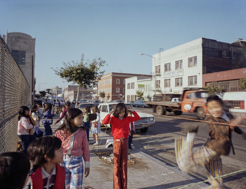 Chinese jumprope in front of Bessie Carmichael School, Folsom Street, 1980