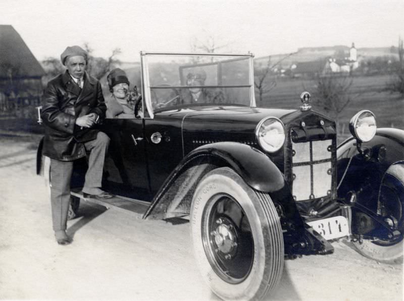 A company of three posing with a Steyr XII on a country road in early spring, 1927