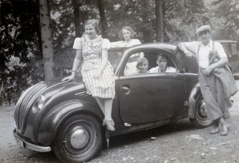Members of an Austrian middle-class family posing with a Steyr 50 in summertime, 1938