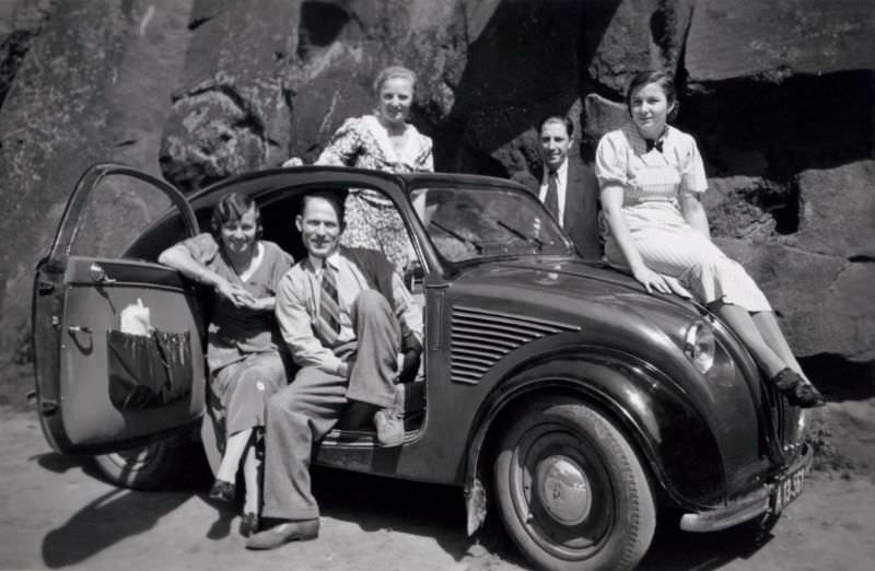 Members of an Austrian middle-class family posing with a Steyr 50 in summertime, 1938