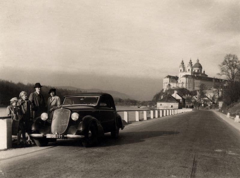 A family pose with a Steyr 220 Gläser Cabriolet on a sunny winter's day, 1939