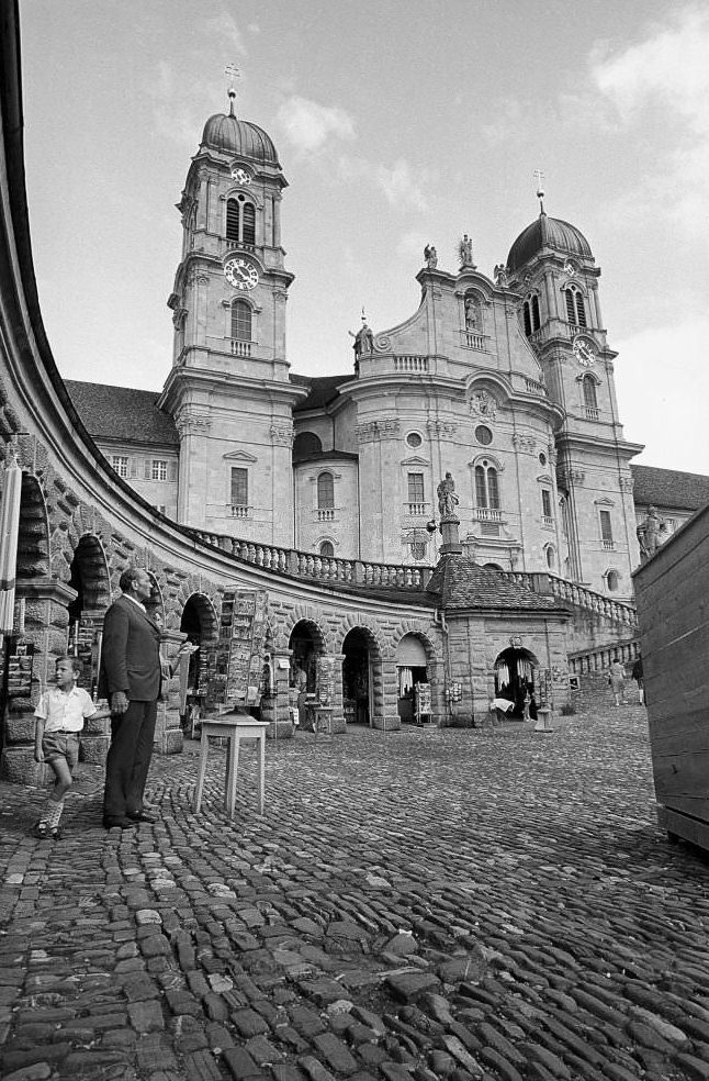 Father and son in front of souvenir shops in Einsiedeln, 1970
