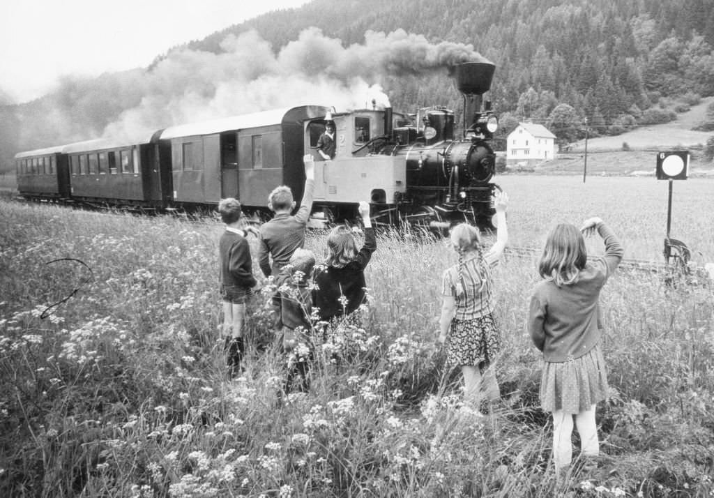 Children wave steam locomotive, 1970s
