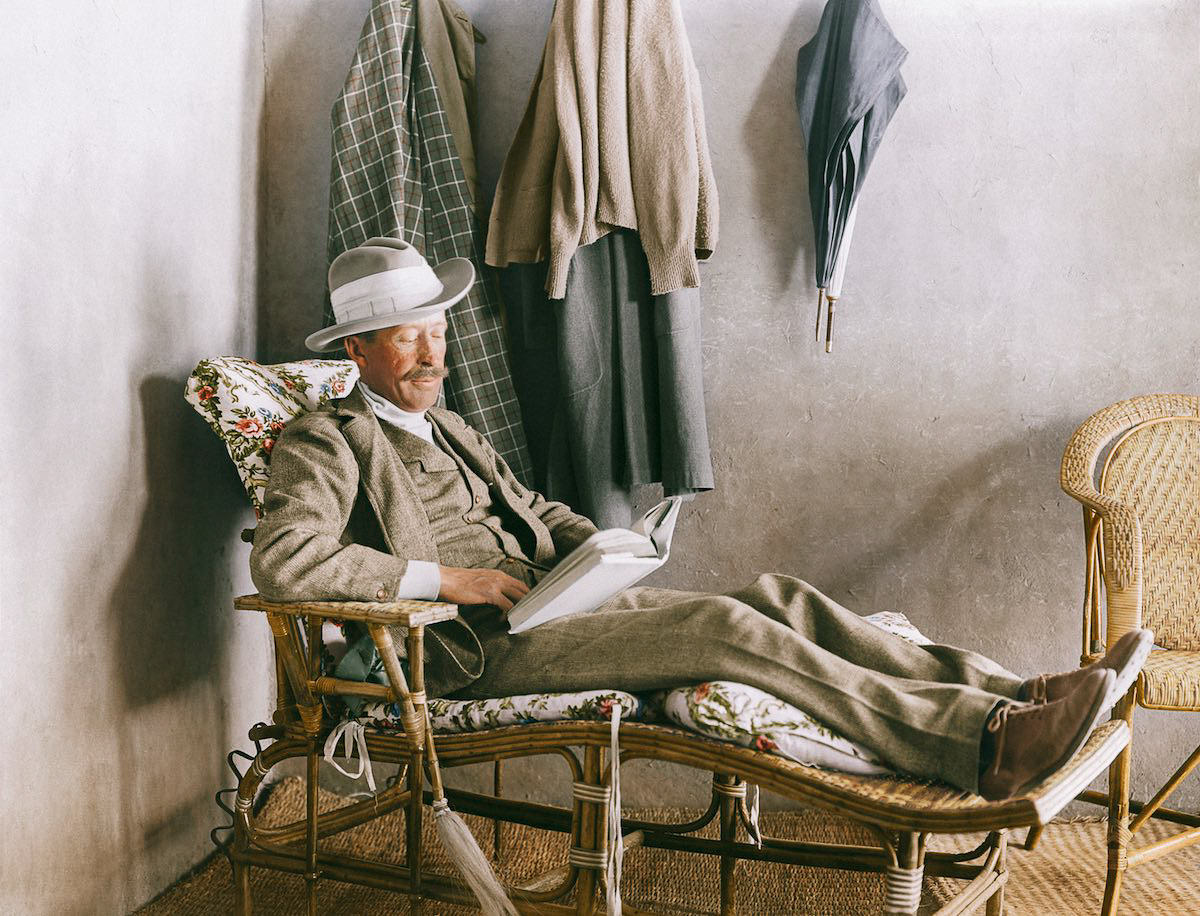 Herbert George Edward Stanhope Molyneux, 5th Earl of Carnarvon, reading on the verandah of 'Castle Carter', Carter's house at Elwat el-Dibbân on the Theban West Bank.