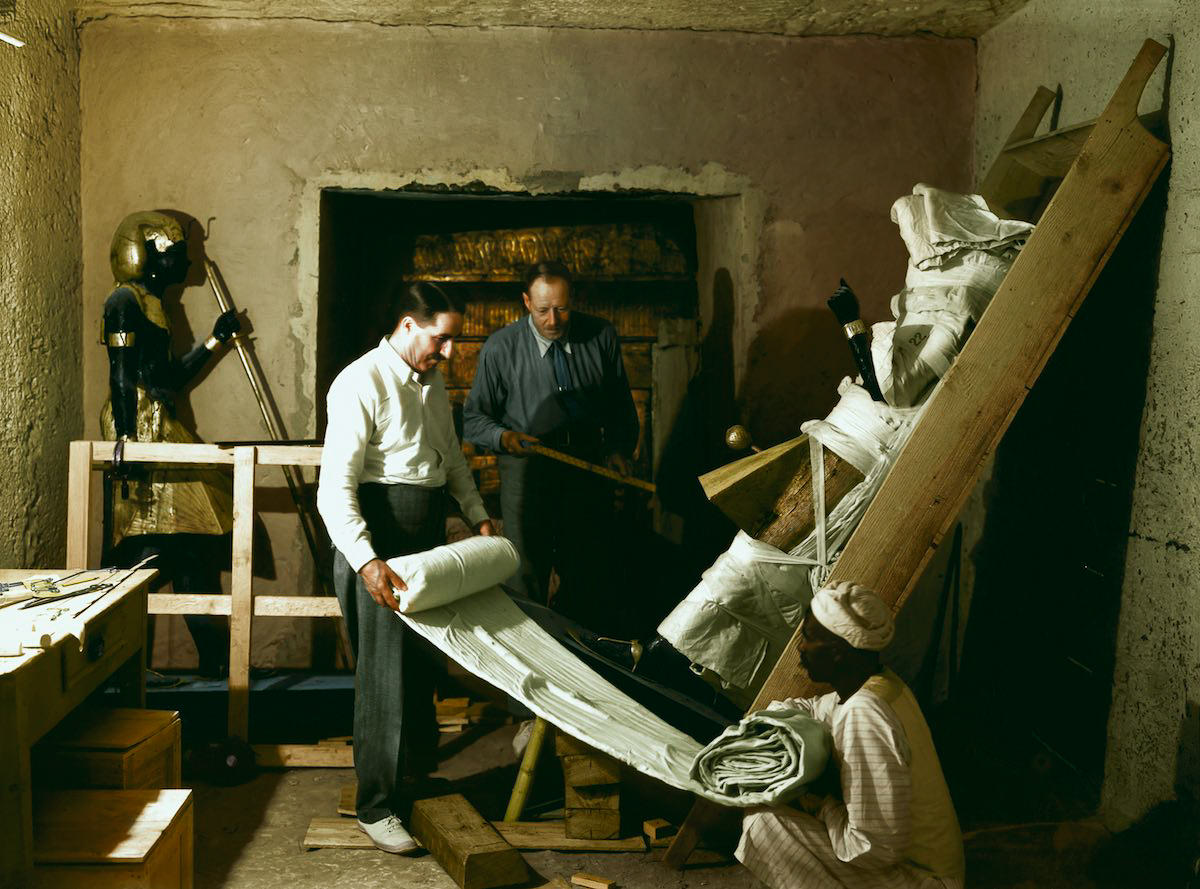 Howard Carter (on the left) working with his friend and colleague Arthur Callender on wrapping one of two sentinel statues of Tutankhamun (Carter no. 22) found in the Antechamber. Tutankhamun's Tomb, December 1925