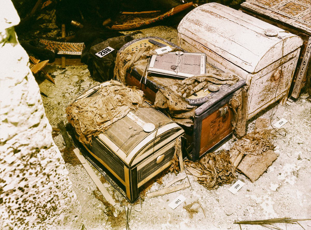 Three wooden chests (the middle one in the shape of a cartouche) on the floor of the Treasury (Carter nos. 267, 269 and 270). Tutankhamun's Tomb, October 1926