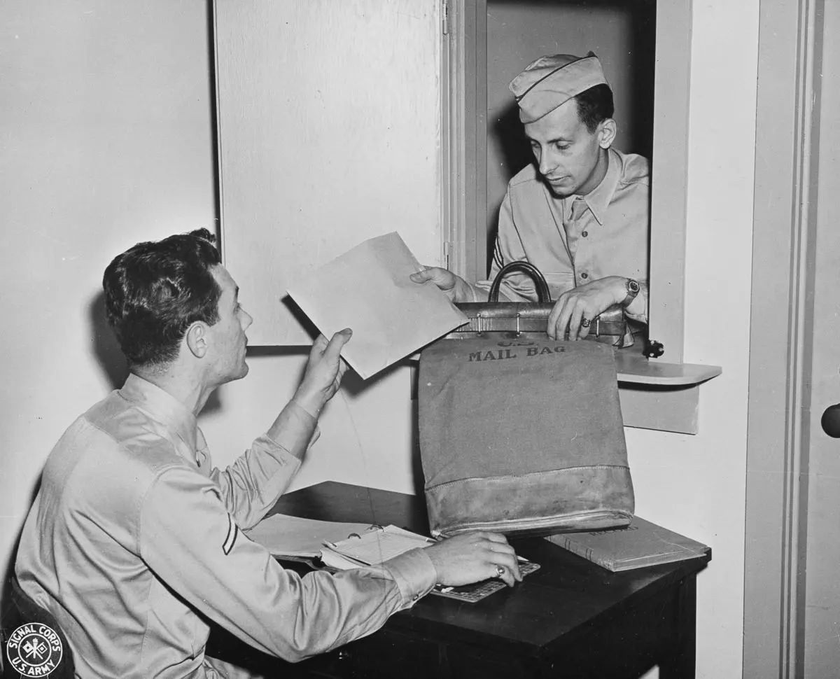 A courier delivers letters for filming and reproducing at the official photo mail station at the Pentagon.