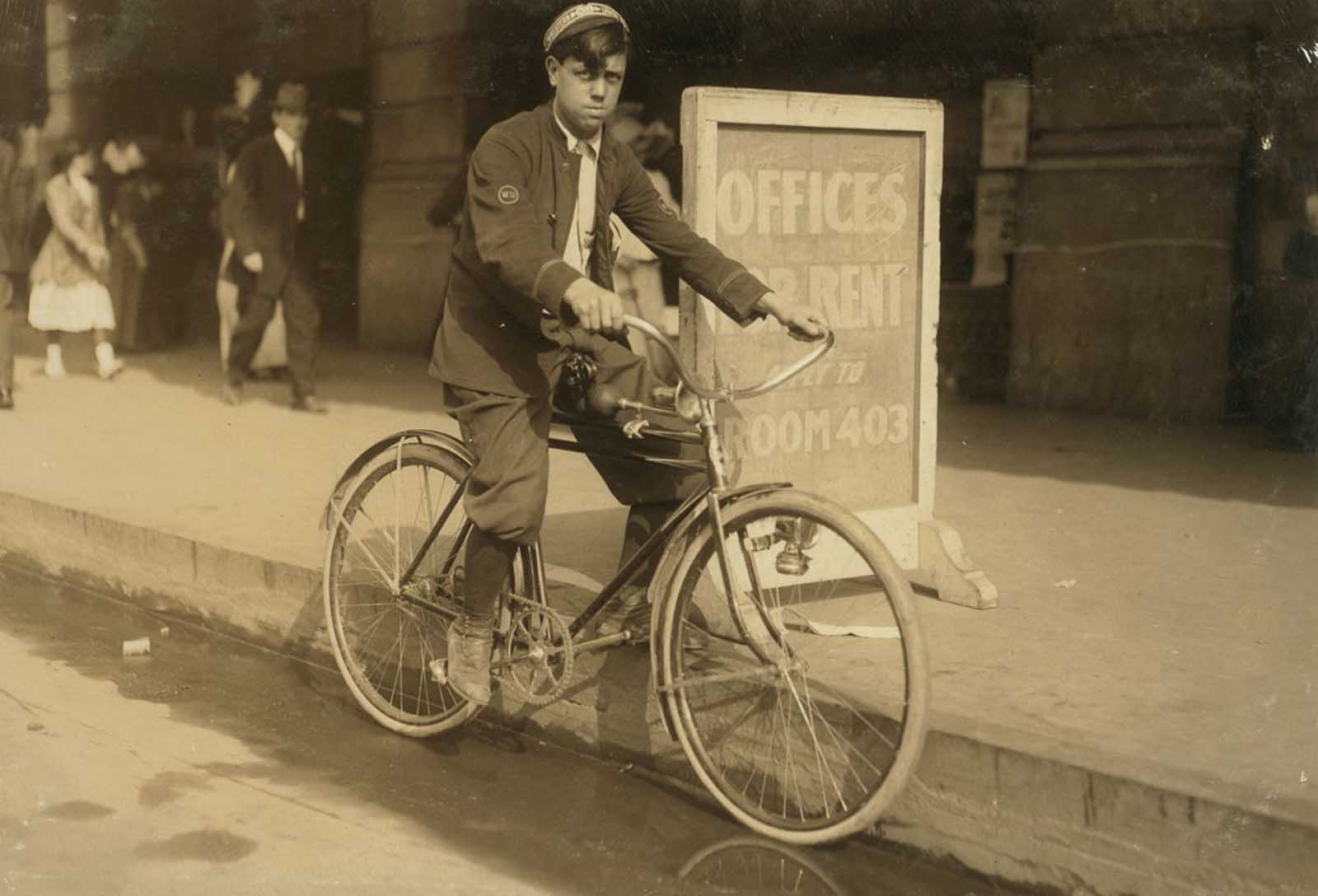 A typical messenger boy in New Orleans. The telegraph companies are trying to obey the law, and few violations occur, November, 1913.
