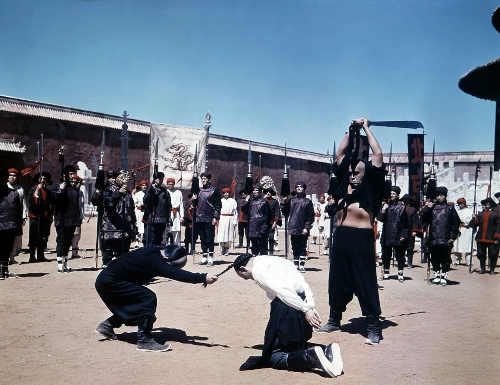 A man is killed in a scene from the film '55 Days At Peking', 1963.