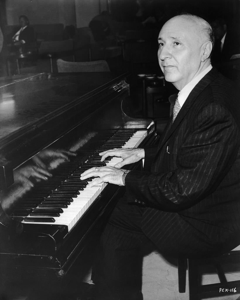 Ukrainian film score composer Dimitri Tiomkin working on the music for '55 Days at Peking', 1963.