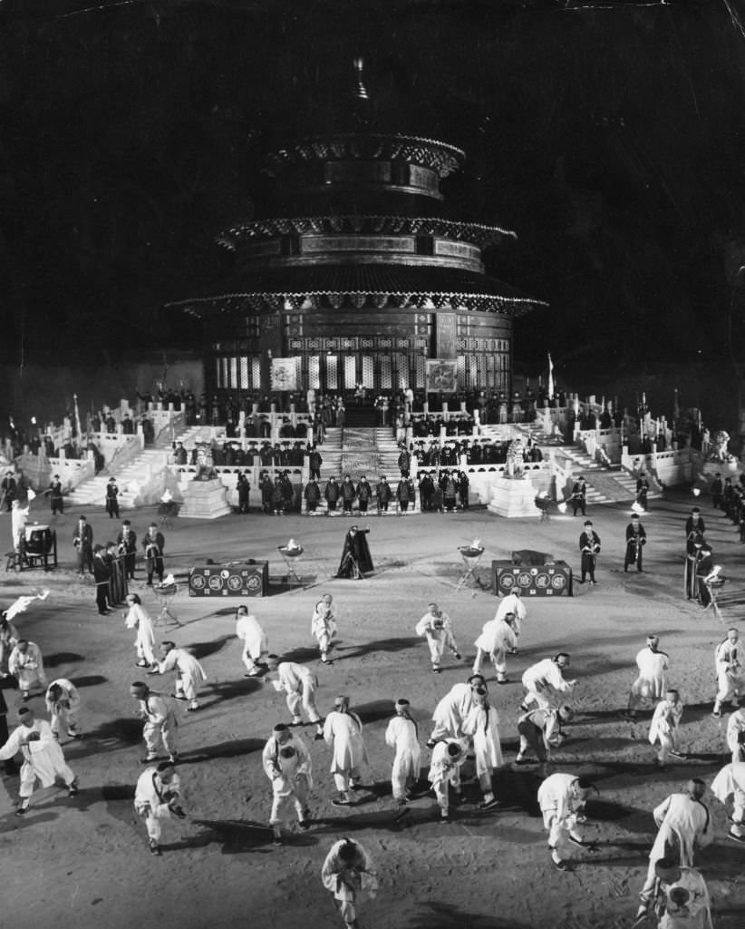 Robert Helpmann as Prince Tuan conducting the Boxer Induction Ceremony in the courtyard of the Temple of Heaven for the Dowager Empress Tsu Hsi in a scene from Samuel Bronston's '55 Days At Peking', 1963