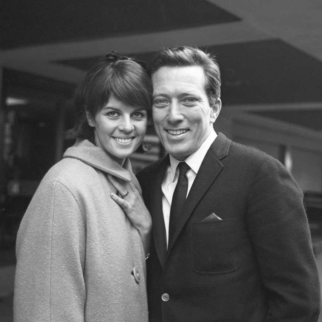 American singer Andy Williams whit hsi wife Claudine on their arrival at Heathrow Airport, 1963