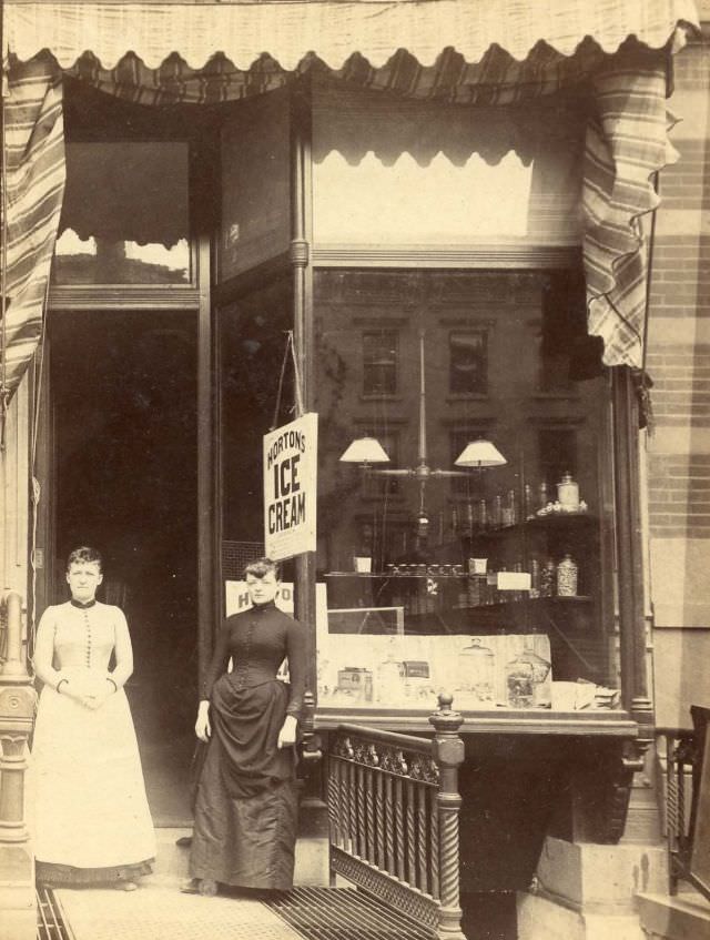 Two women outside store selling Horton's ice cream, 352 Pleasant St., New York, 1880s