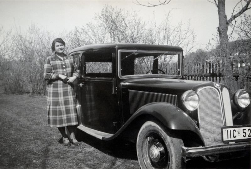 A lady in a checkered dress posing with a BMW 303 saloon on a sunny day in early spring, 1935.