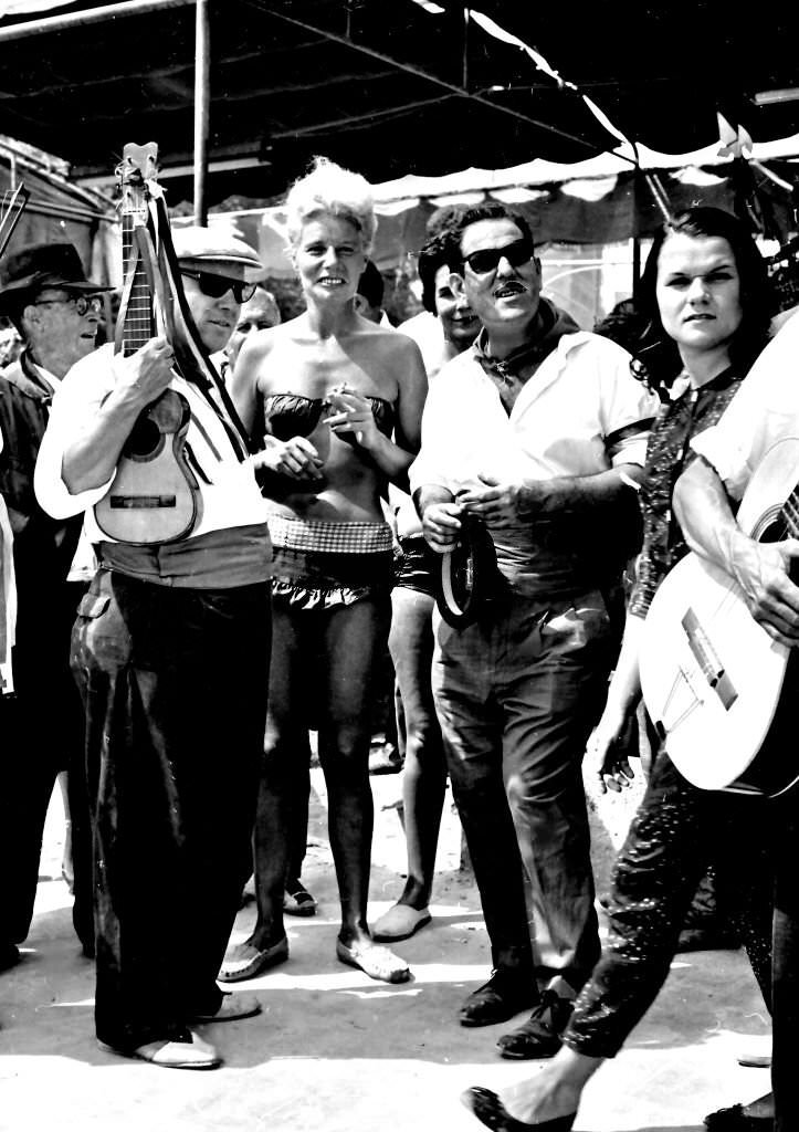 The first tourists in Benidorm, when this town was only a fishing village, Alicante, Spain, 1964.