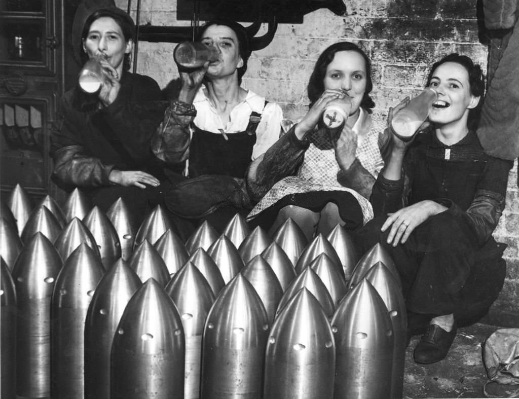 Armoury workers drinking milk to counteract the effects of their exposure to lead in the atmosphere of their factory, 1941