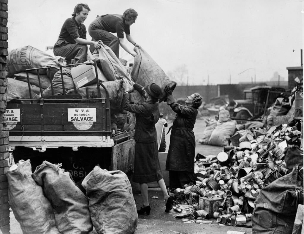The WVS (Women's Voluntary Service) unloading salvage at a depot where it is to be sorted, 1941