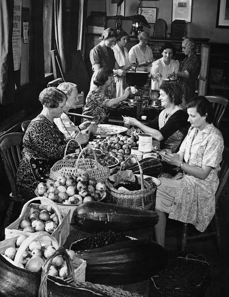 Ladies of the Women's Institute at Brimpton are busy making jam of all kinds - plum, apple, marrow, ginger and blackberry.