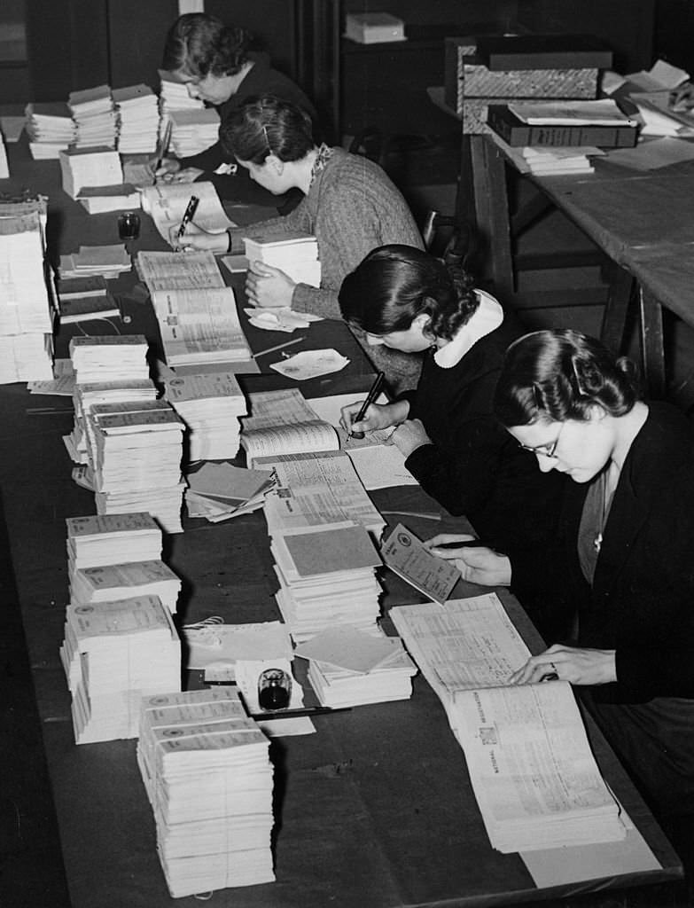 Women at the Food Executive Office in London prepare ration books from the National Registration returns.
