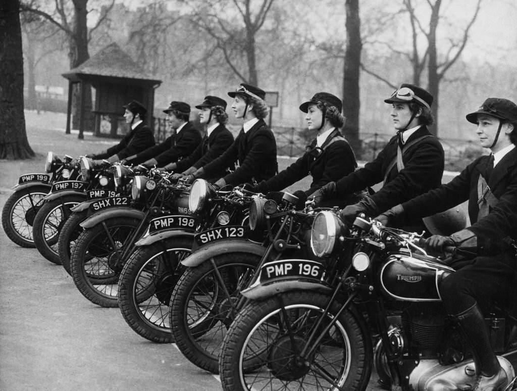 Wren despatch riders for the Women's Royal Naval Service (WRNS) attached to WRNS London Headquarters with their Triumph 350CC 3SW motorcycles on 11th March 1941 in London, England.