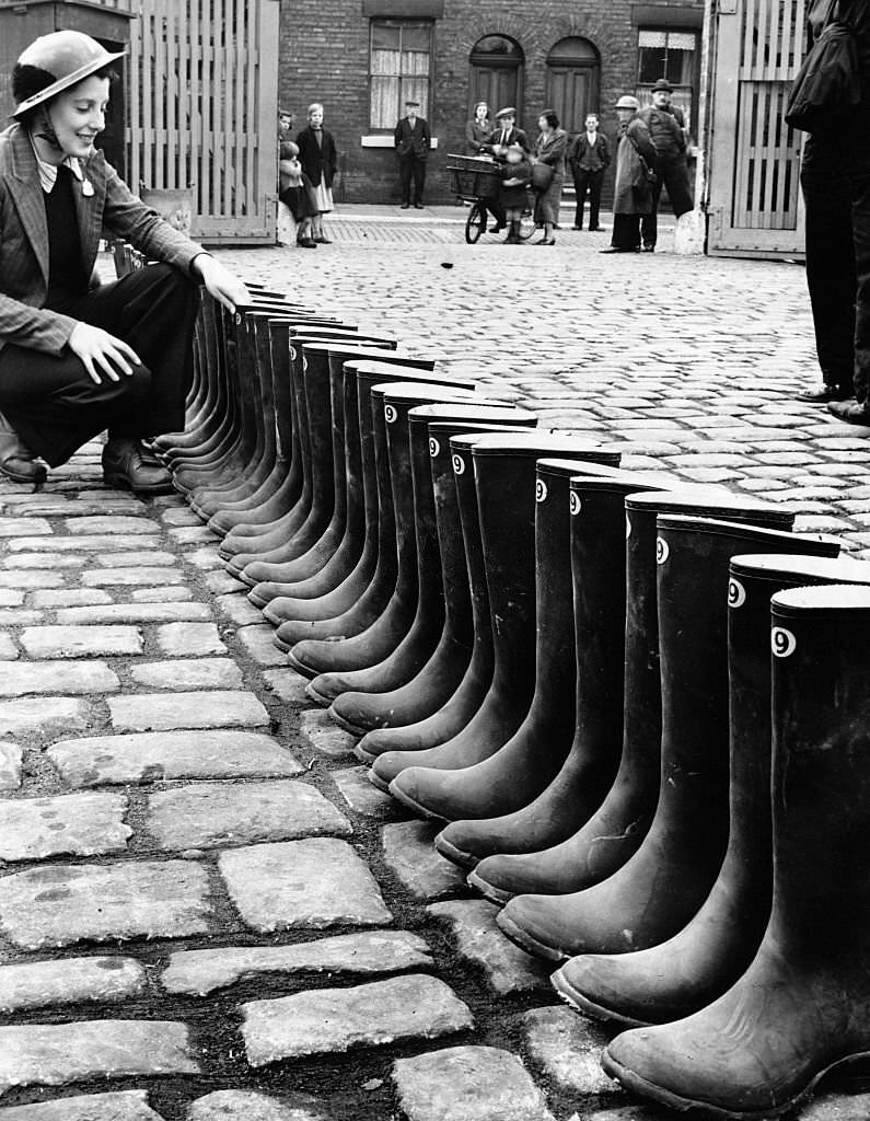 Inspecting wellingtons of Auxiliary Fire Service in Manchester, England, 1939.