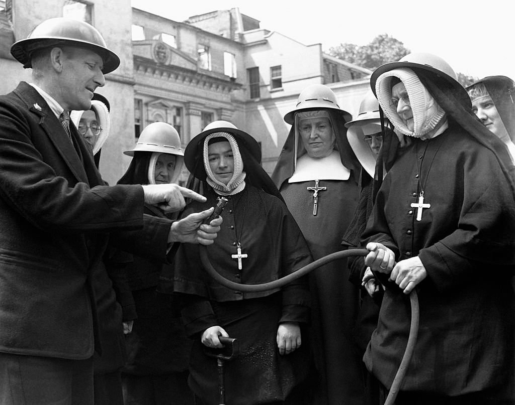 Nuns receiving fire drill instruction in the UK during World War II, 1939