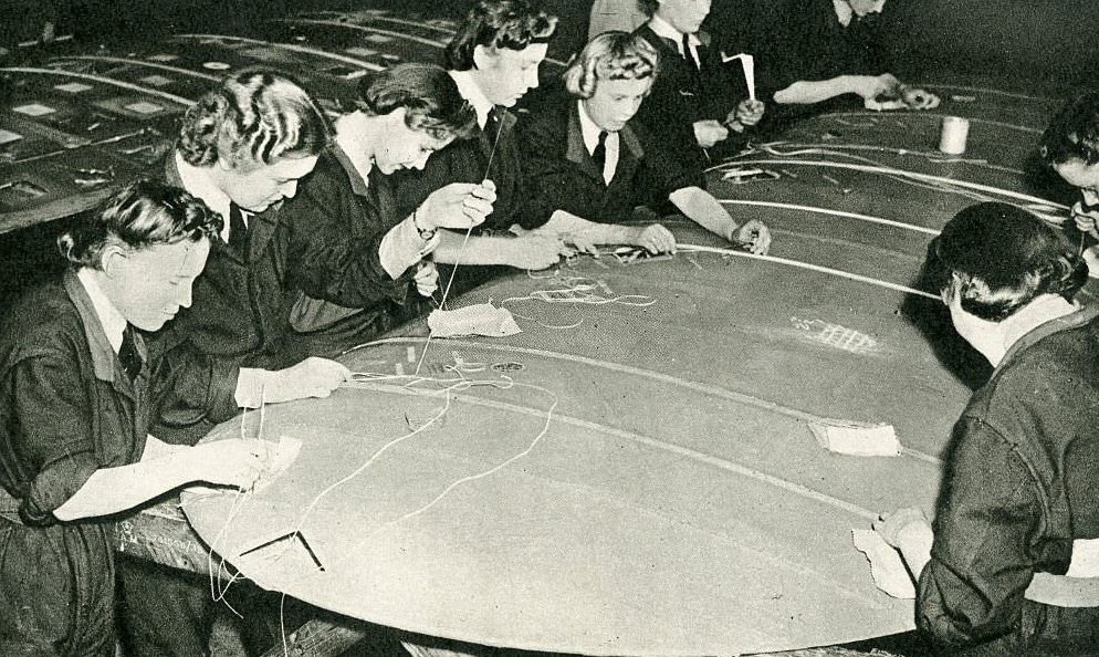 British Womens Auxiliary Air Force. Women repairing plane fabric. Female auxiliary division of Royal Air Force.