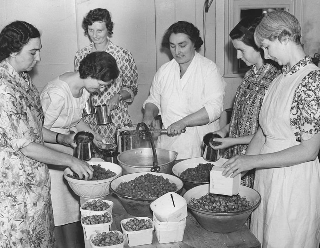 A village 'jam depot' organised by the Women's Institute on behalf of the government to use up all excess home grown fruit, 1941