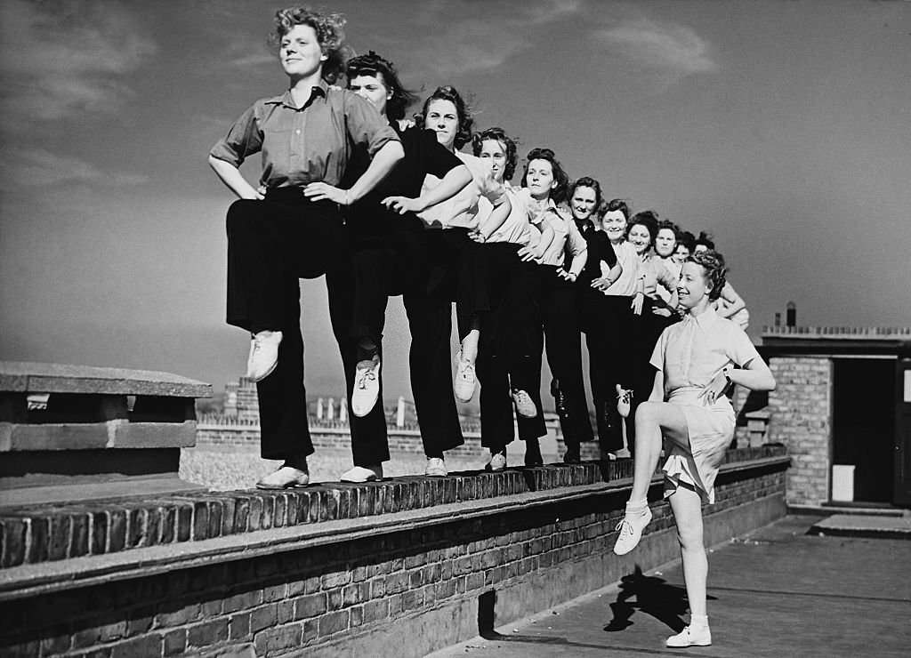 Women firefighters exercise on the roof of their headquarters in Walthamstow, 1944.