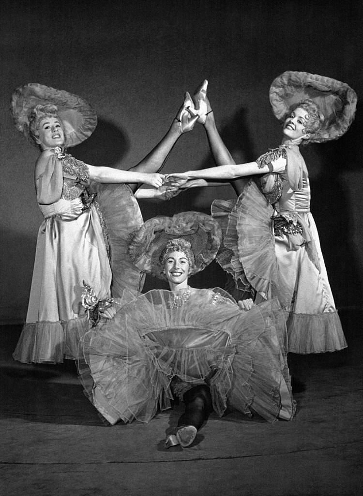 Clare Courtney, Valerie Dawling and Angela Bracenell in a quick French Cancan number, the highlight of the show, 1900