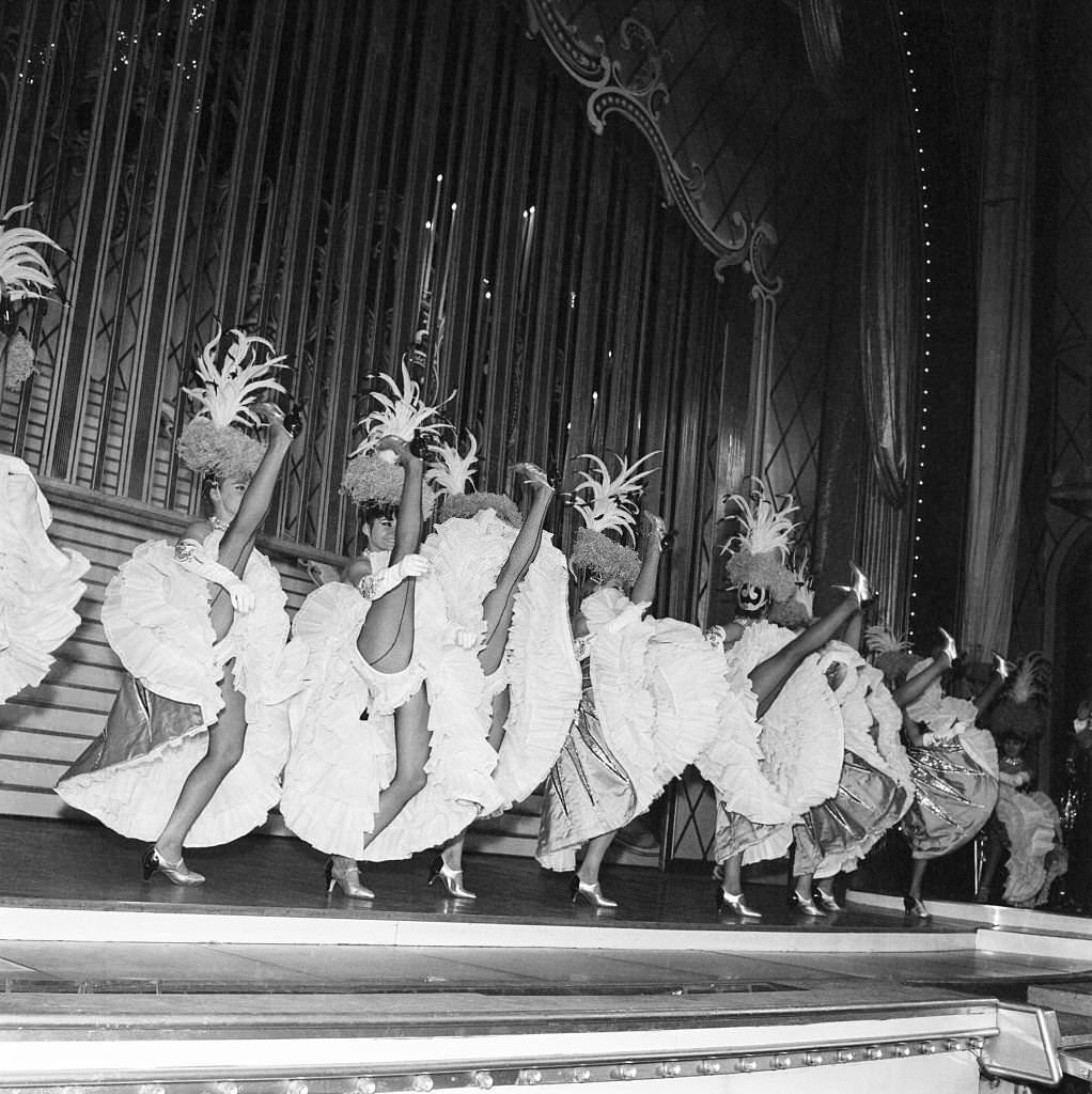 The French CanCan is a lways popular at the Paris Folies Bergere theater.