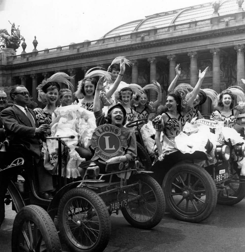 The French cancan dancers of the Moulin Rouge give the start of the 'crusade of prudence 54' in front of the Grand Palais in Paris, 1954