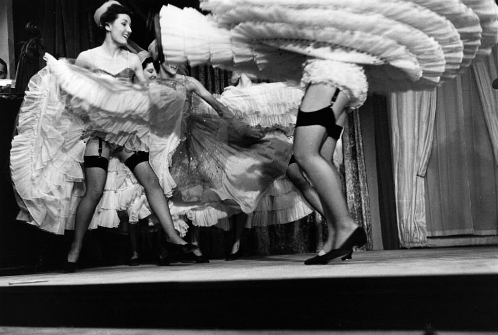 Women dancing the cancan, Montmartre-style, at Piccadilly, London, 1951.